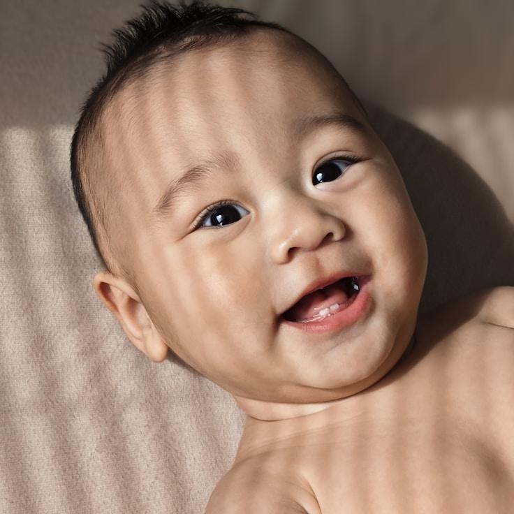 Aisha Raman, Lead Design Curator at Road Curren Taxis, reviewing corporate floral arrangements